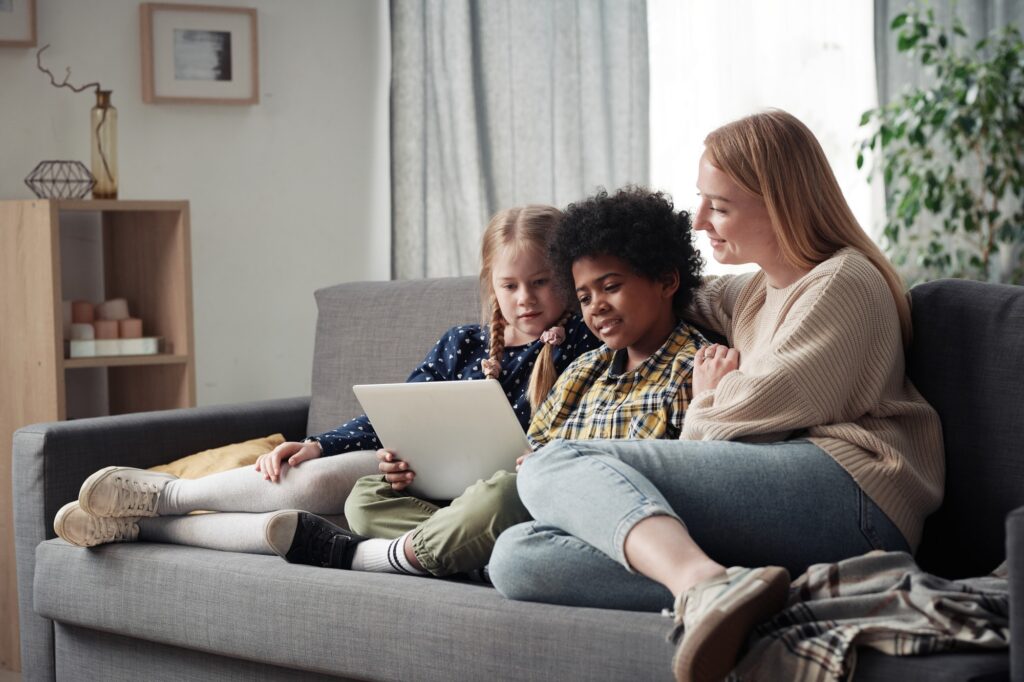 Family of three watching movie on laptop